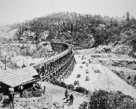 Chinese labourers working on a trestle bridge on the western slope of the Sierra Nevada mountains, 1 19th