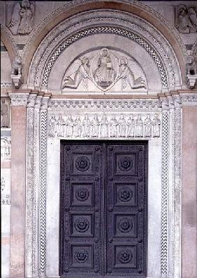 Portal with carved architrave depicting Christ in a Mandorla with two angels and the apostles below c.1230s
