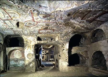 Interior of a catacomb chamber cut from tufa stone showing fragments of frescoed decoration von Anonymous