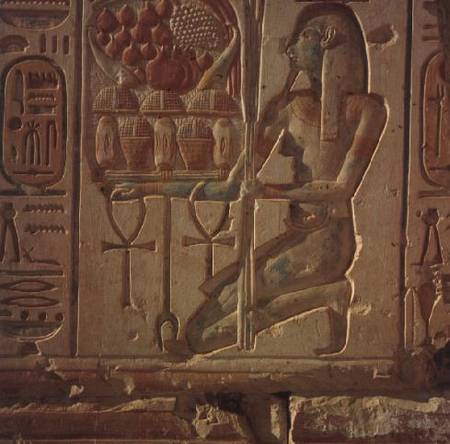 Kneeling figure presenting baskets of food, from the Temple of Ramesses II von Anonymous