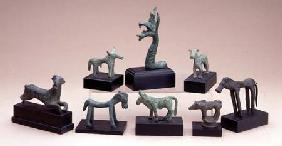 Collection of Greek bronze animals including a boara griffin and a running deer ranging fr