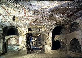 Interior of a catacomb chamber cut from tufa stone showing fragments of frescoed decoration 2nd centur