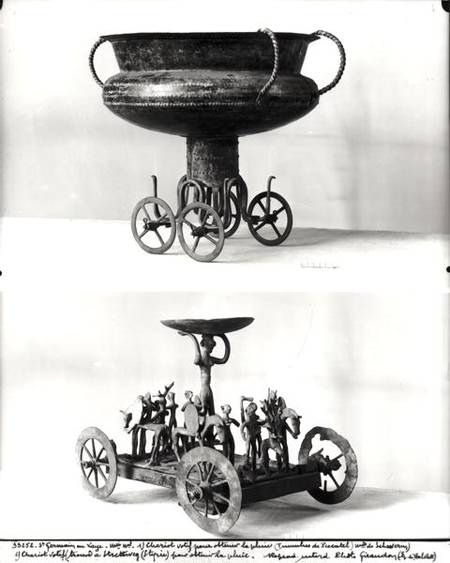 Two votive chariots for collecting rainwater: Top - cup supported on four wheels from the Peccatel t von Bronze  Age