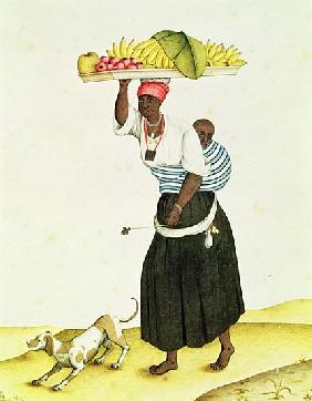A Woman Carrying a Tray of Fruit on her Head