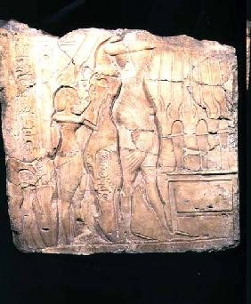 Relief fragment depicting Akhenaten followed by Nefertiti and Meritaten before an offering table, Ne