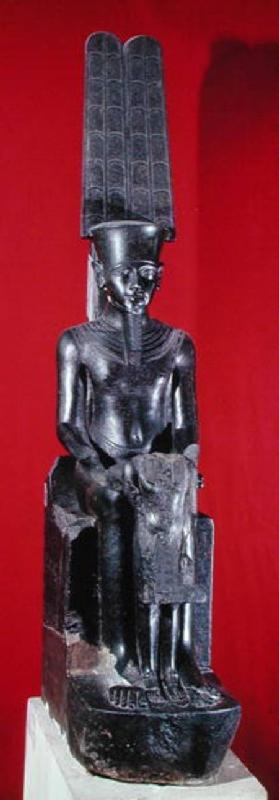 Seated statue of the god Amon protecting Tutankhamun, New Kingdom c.1336-132