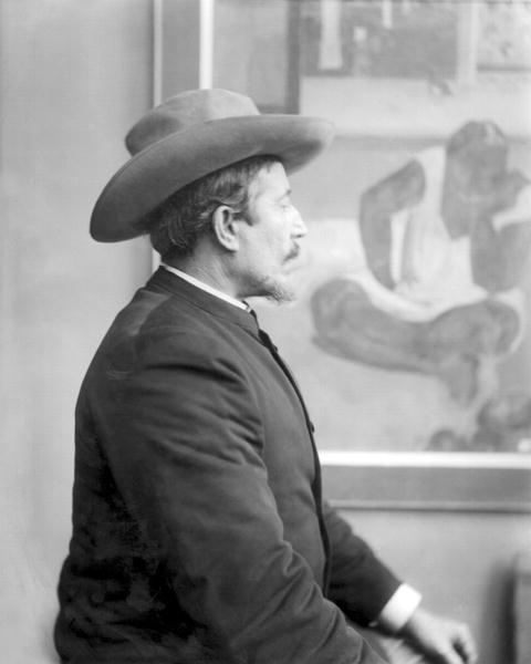 Paul Gauguin (1848-1903) in front of his canvases (b/w photo)  von French School