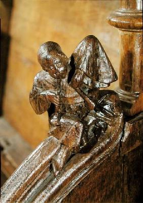 Musician playing a double flute, detail from a choir stall 14th-16th