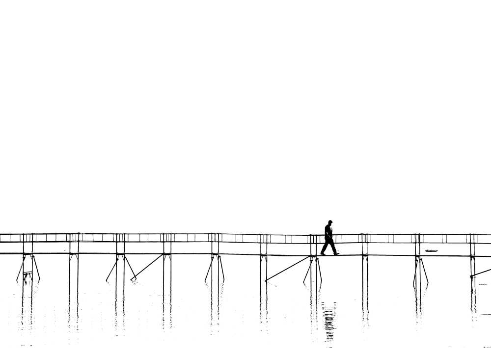 The lonely man on the plank bridge von Hans Peter Rank