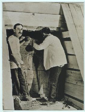 Howard Carter (1873-1939) and a colleague beside a partially demolished wall of one of the tombs, Va