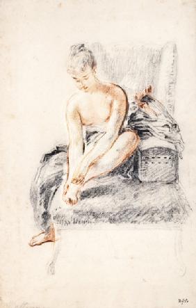 Semi-nude woman seated on a chaise longue, holding her foot (sanguine and black chalk on paper)