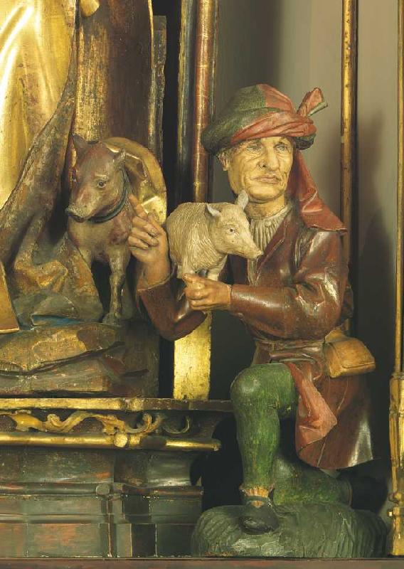 Isenheimer Altar, Detail: Mann mit Schwein (zu Füßen des Hl. Augustinus). von Niklaus von Hagenau