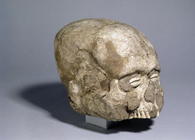 Portrait skull with cowrie shell eyes, Jericho, c.7th millennium BC (skull, plaster and shell) (side 1511