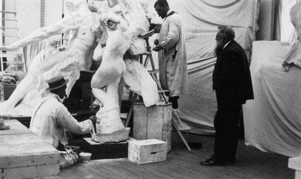 Auguste Rodin (1840-1917) in his Paris studio watching the construction of a sculpture, 1905 (b/w ph von 