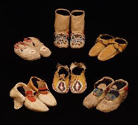 A Selection Of American Indian Hide Moccasins From Varoius Tribes; Clockwise From Top Left - Upper M
