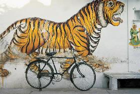 Bicycle at wall painting of tiger , Udaipur, Rajasthan, India (photo) 