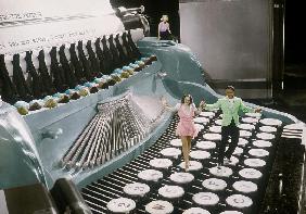 Couple dancing on the key of a giant typewriter, keys are leg of dancers, musical, 30's colourized d 30's