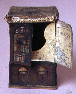 Doll's house furniture: Cardboard bookcase, embossed inside showing a map with the new Australian go von 
