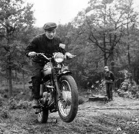 French Singer Ricet Barrier on a moto April 1965