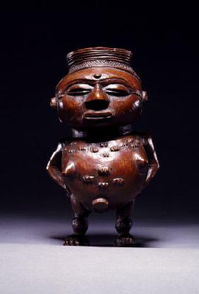 Face On View Of A Wongo Cup Carved As A Female Standing Figure With Spherical Body