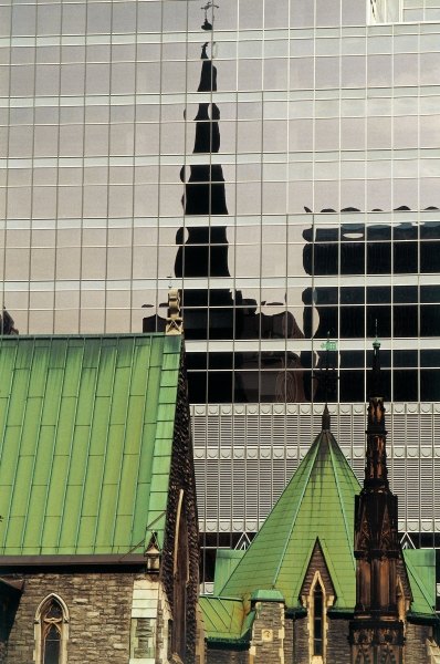Green roofs and church reflected in glass panels (photo)  von 