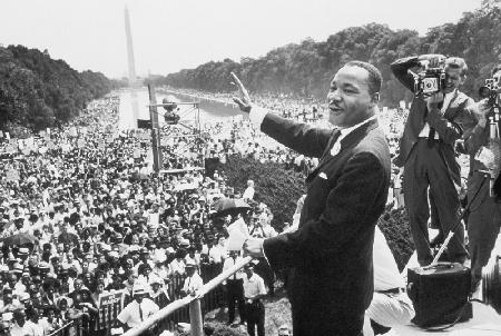 Martin Luther King American priest activist for Civil Right Movement of black Americans saluting the August 28,