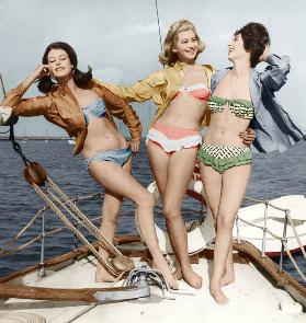 Three young women wearing bikinis colourized document late 50's 