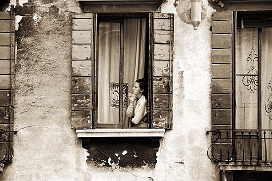 Woman gazing out of a window contemplating, 2004 (b/w photo)  von Stephen  Spiller