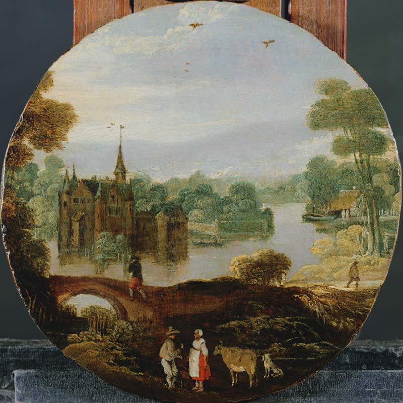 A wooded river landscape with a castle and travellers conversing von Tobias Verhaecht