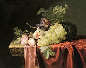 A still life with grapes, plums, figs and a melon on a partly draped stone ledge 1653