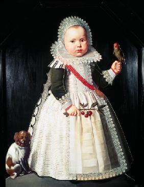 Portrait of a young boy holding a parrot